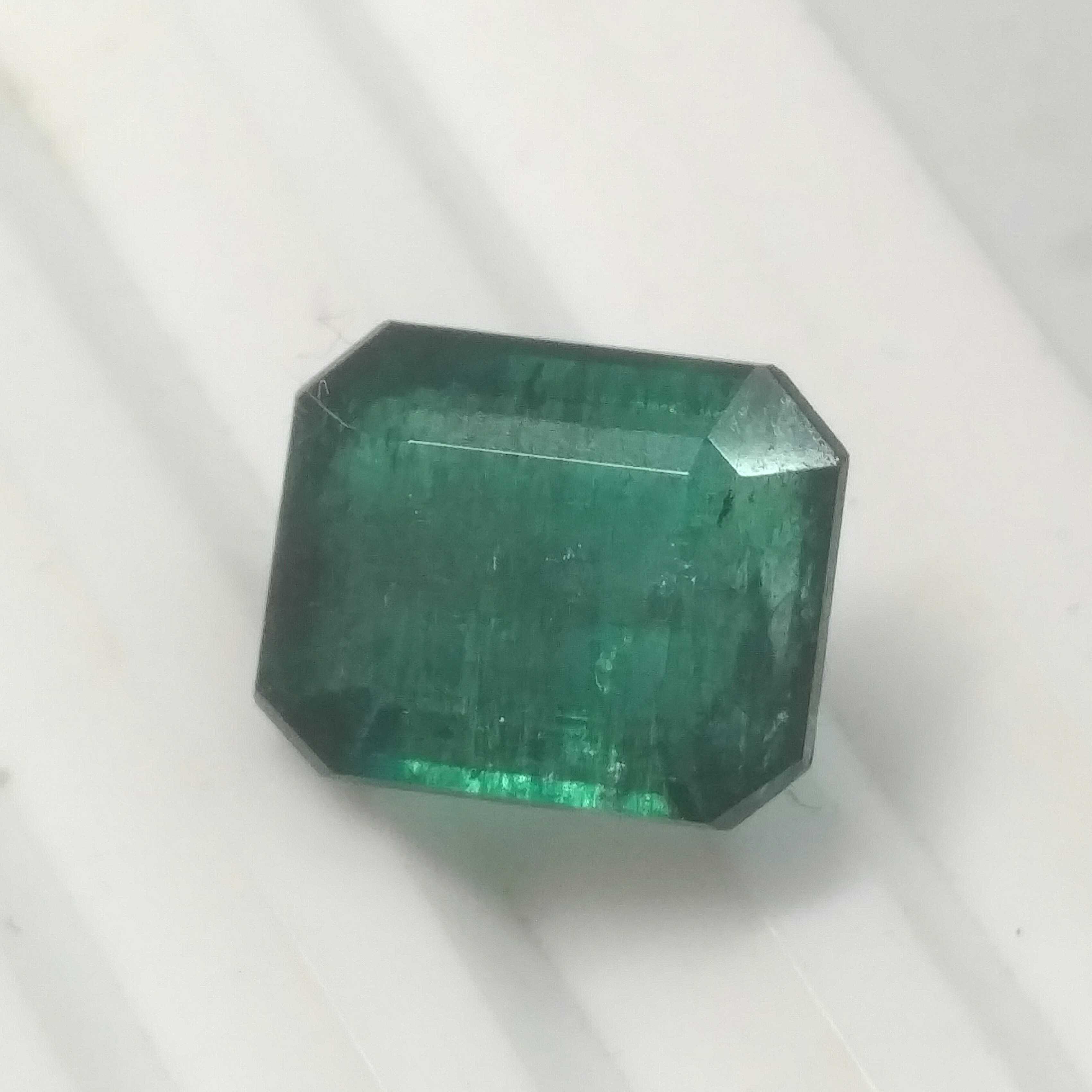 6.59ct octagon step cut deep glaas green Zambian emerald 
