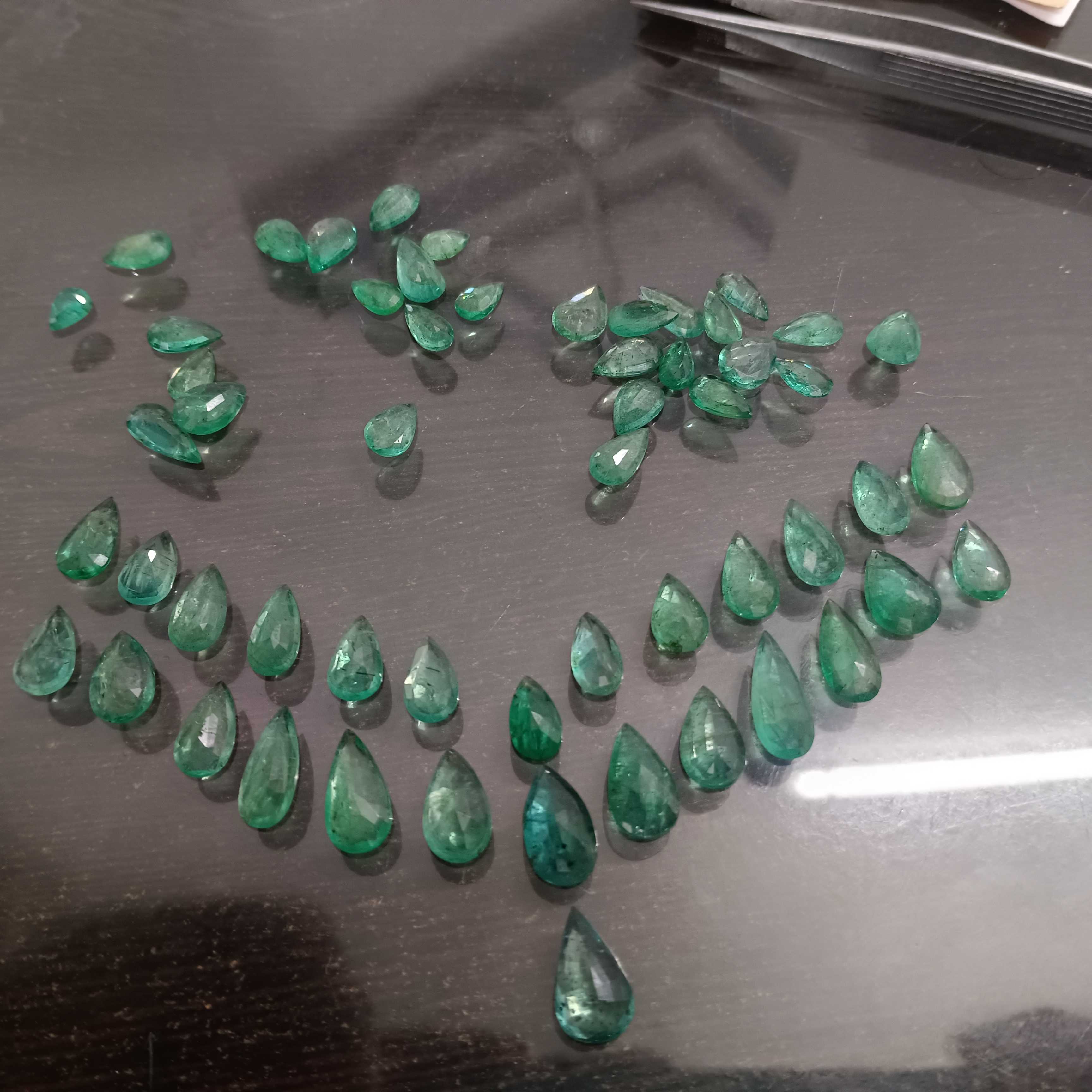 97ct medium green pear shape emerald layout parcel