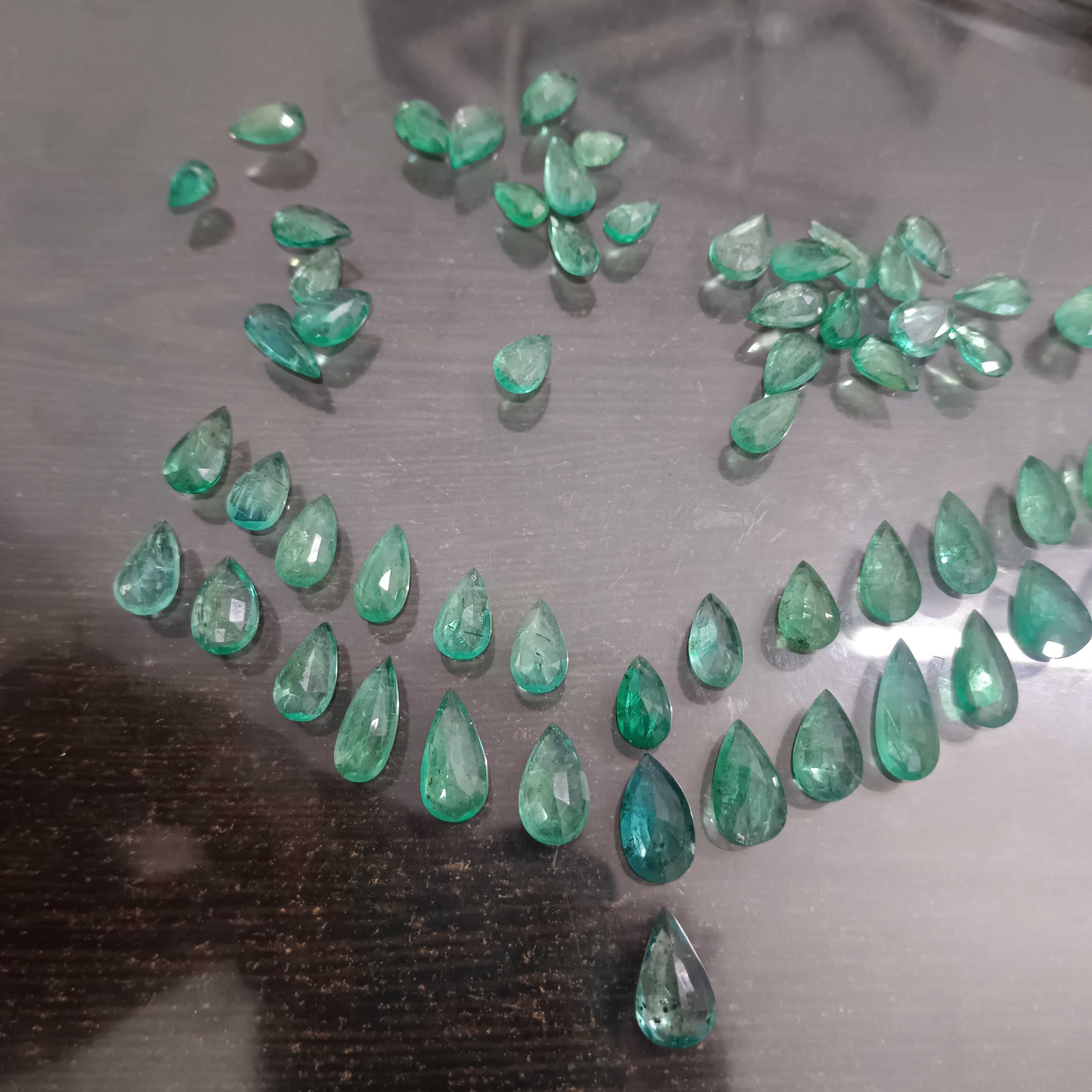 97ct medium green pear shape emerald layout parcel
