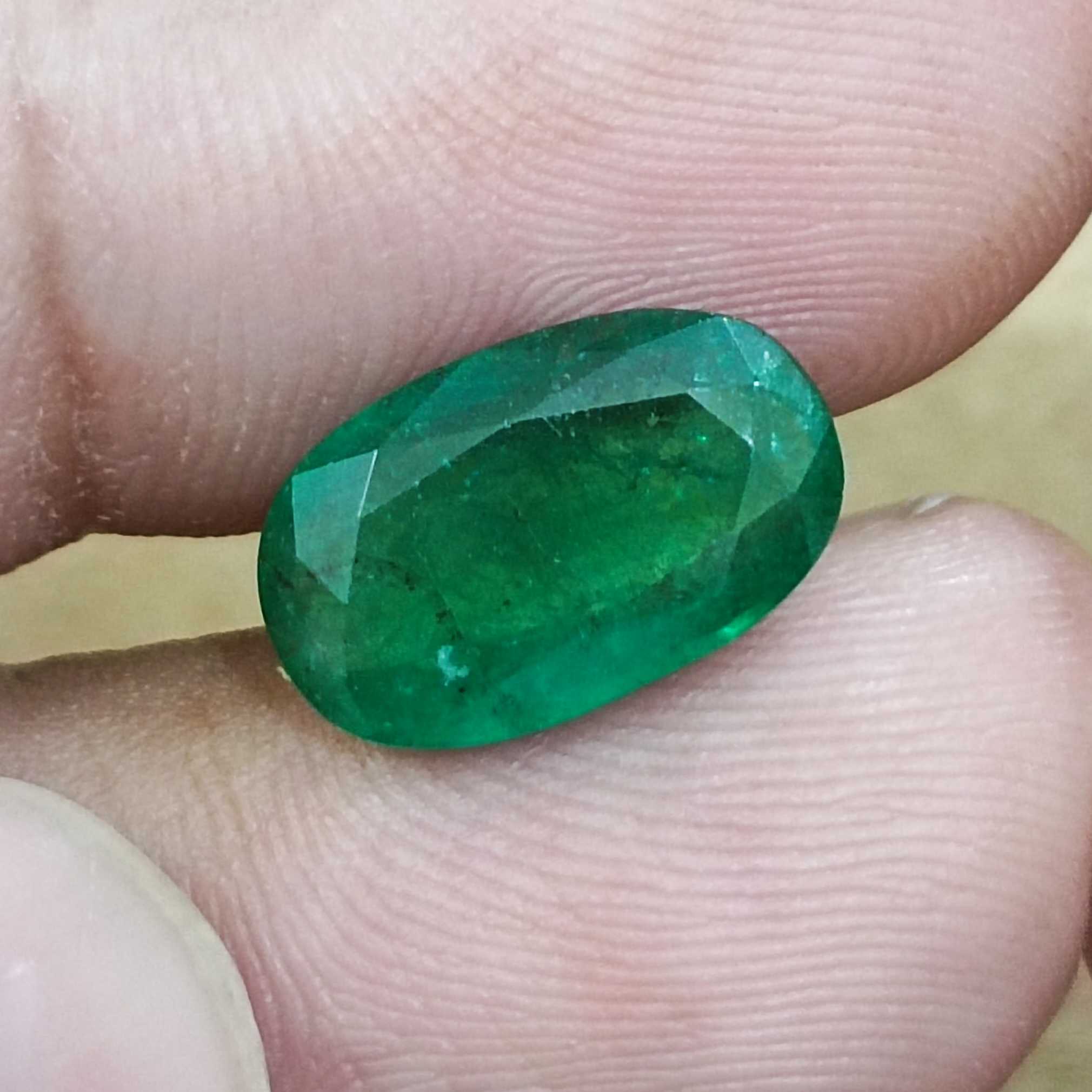 4.36ct GSI certified deep green elongated oval cut Zambian emerald gem  
